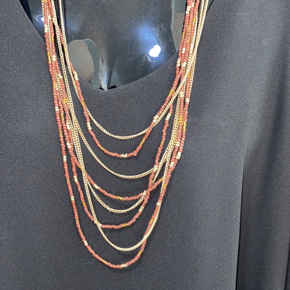 Eight layer gold and brown beaded necklace
